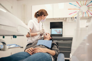 female dentist scanning teeth of woman 2022 03 04 05 57 31 utc 1